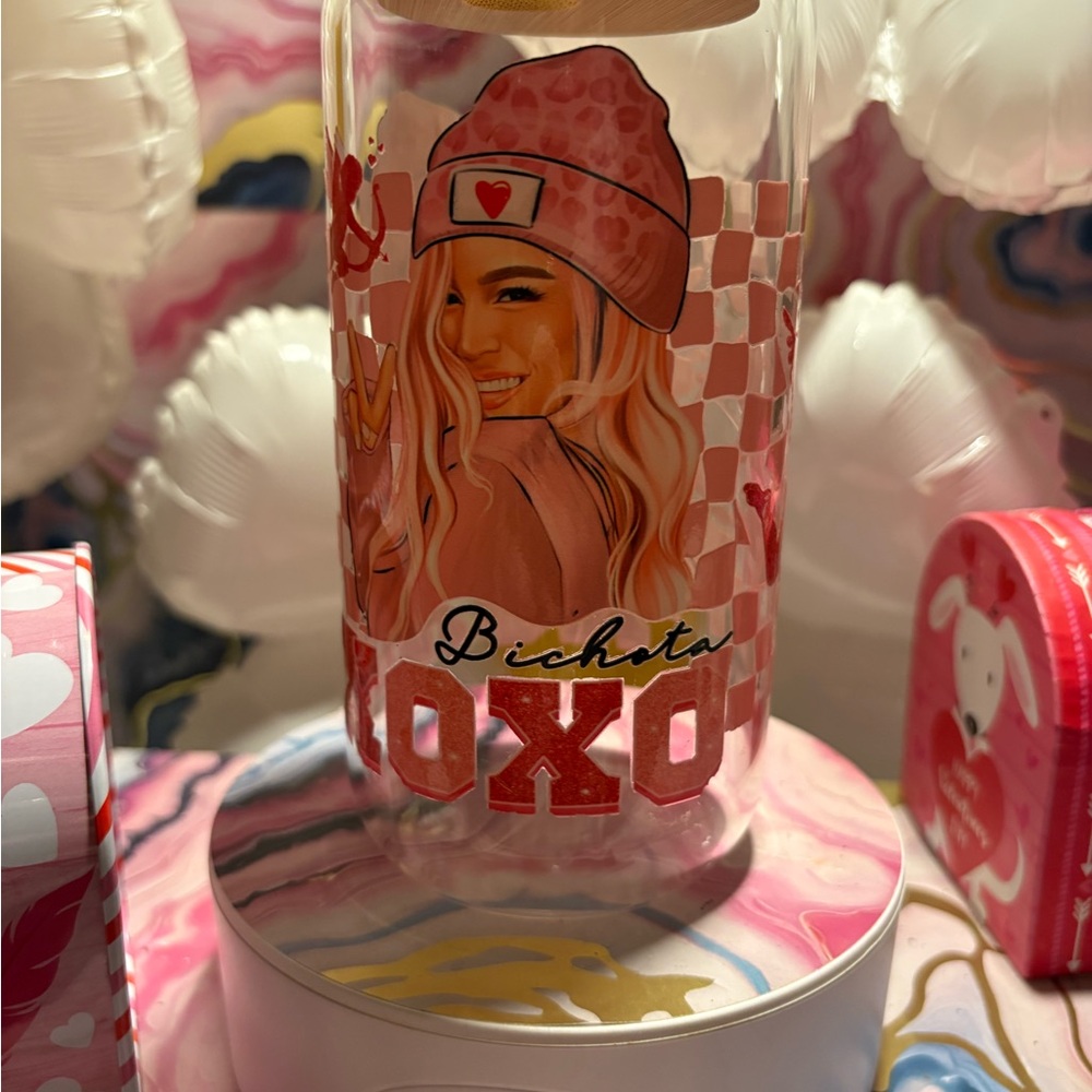 Glass cup with Valentine's Day UV DTF design.